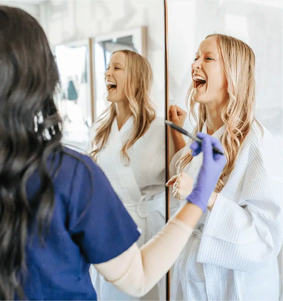 Bodify provider and client laughing together during a consultation